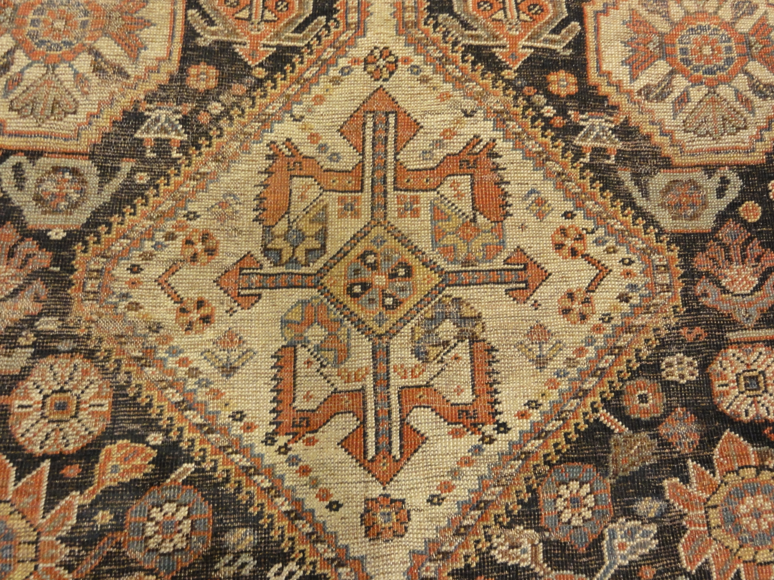 Antique Persian Qashqai featuring Tribal Flowers. A piece of genuine handwoven carpet art sold by Santa Barbara Design Center Rugs and More.