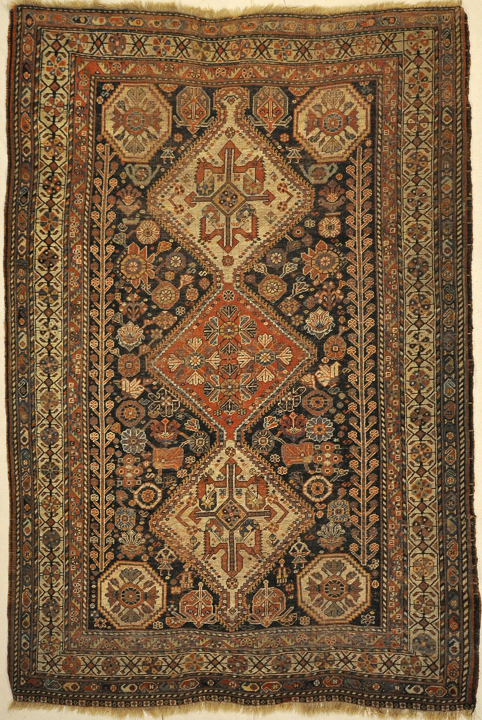 Antique Persian Qashqai featuring Tribal Flowers. A piece of genuine handwoven carpet art sold by Santa Barbara Design Center Rugs and More.