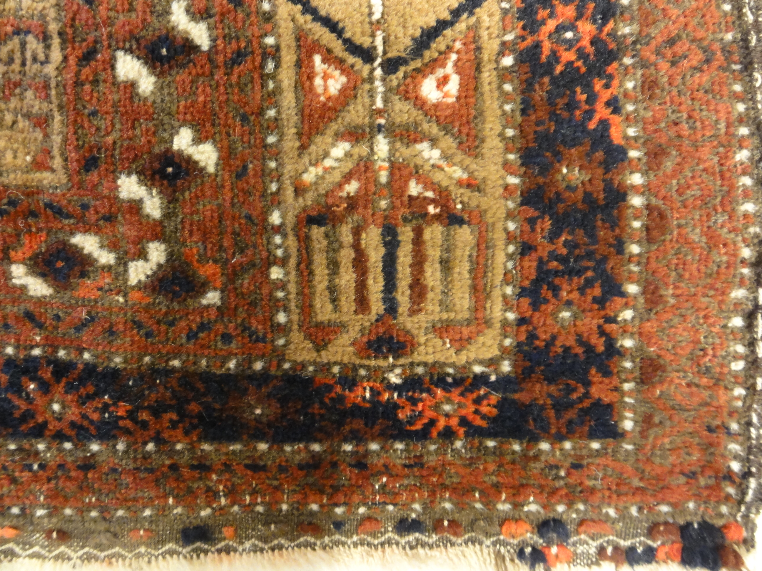 An antique, original Persian Baluch rug. A piece of genuine and authentic carpet art sold at Santa Barbara Design Center. Rugs and More.
