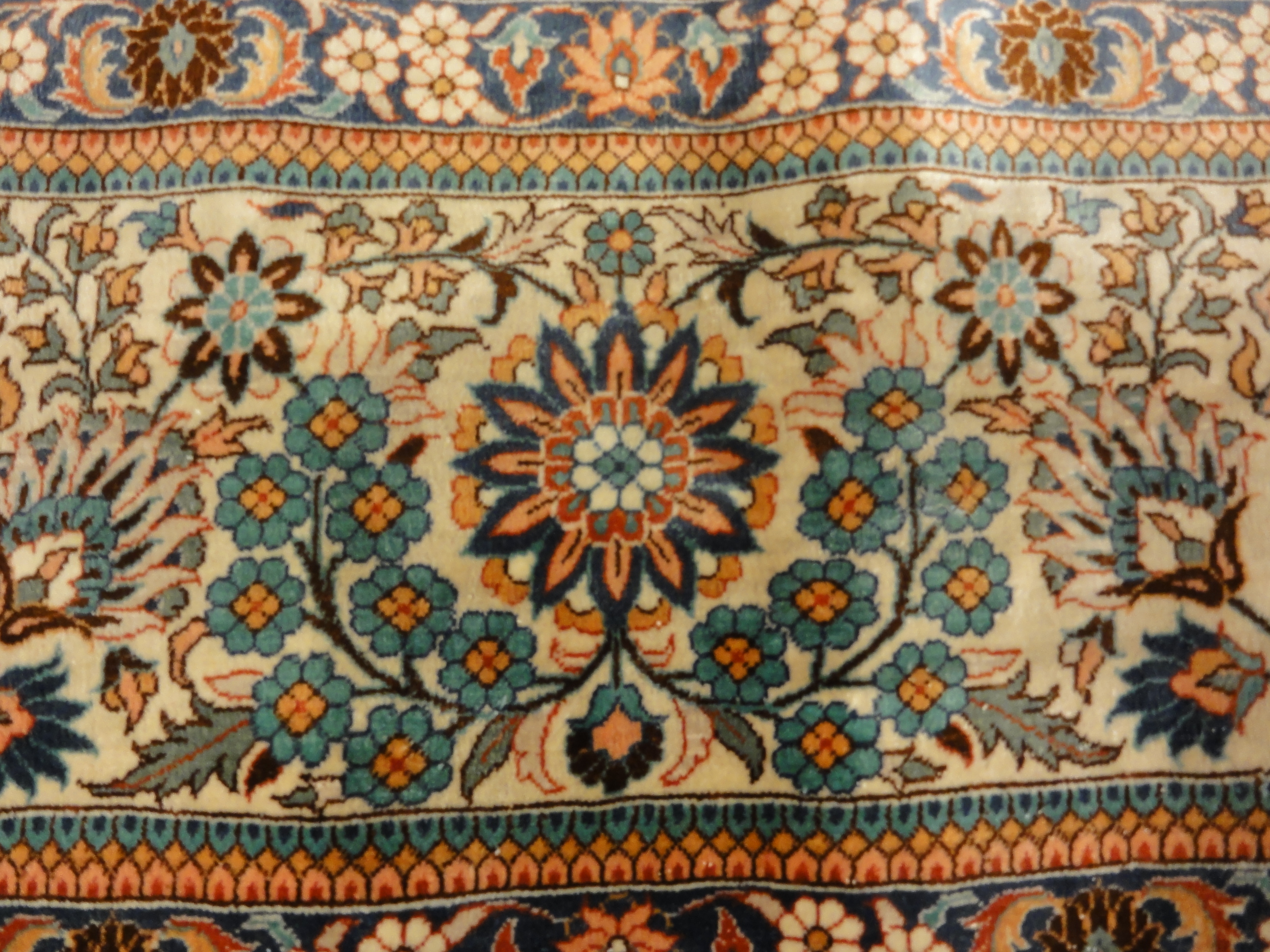 An antique finest silk rug featuring the garden of paradise with 1001 flowers. A piece of genuine woven carpet art sold at Santa Barbara Design Center.