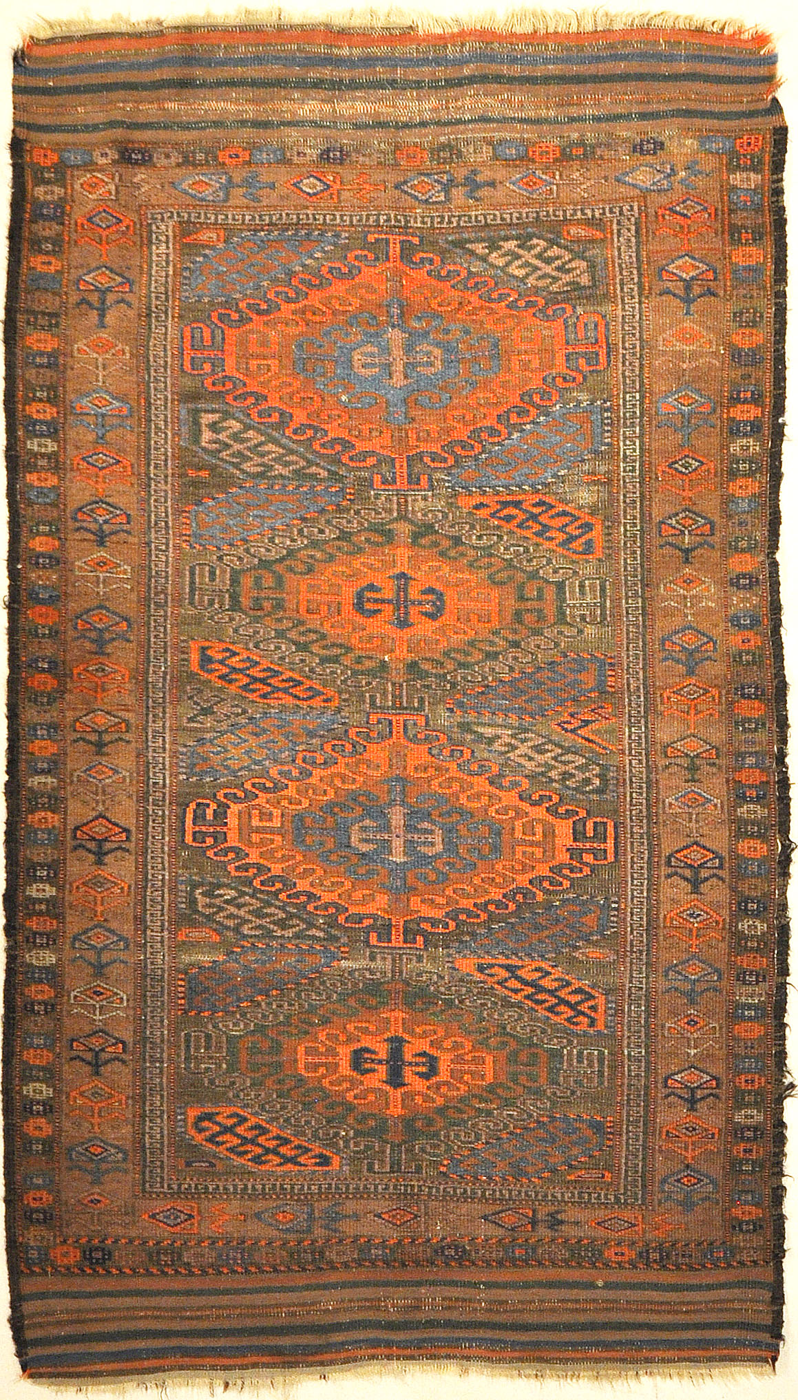 An antique original Mushwani Baluch rug handwoven in Afghanistan. A piece of genuine, authentic woven carpet art. Sold by Santa Barbara Design Center.