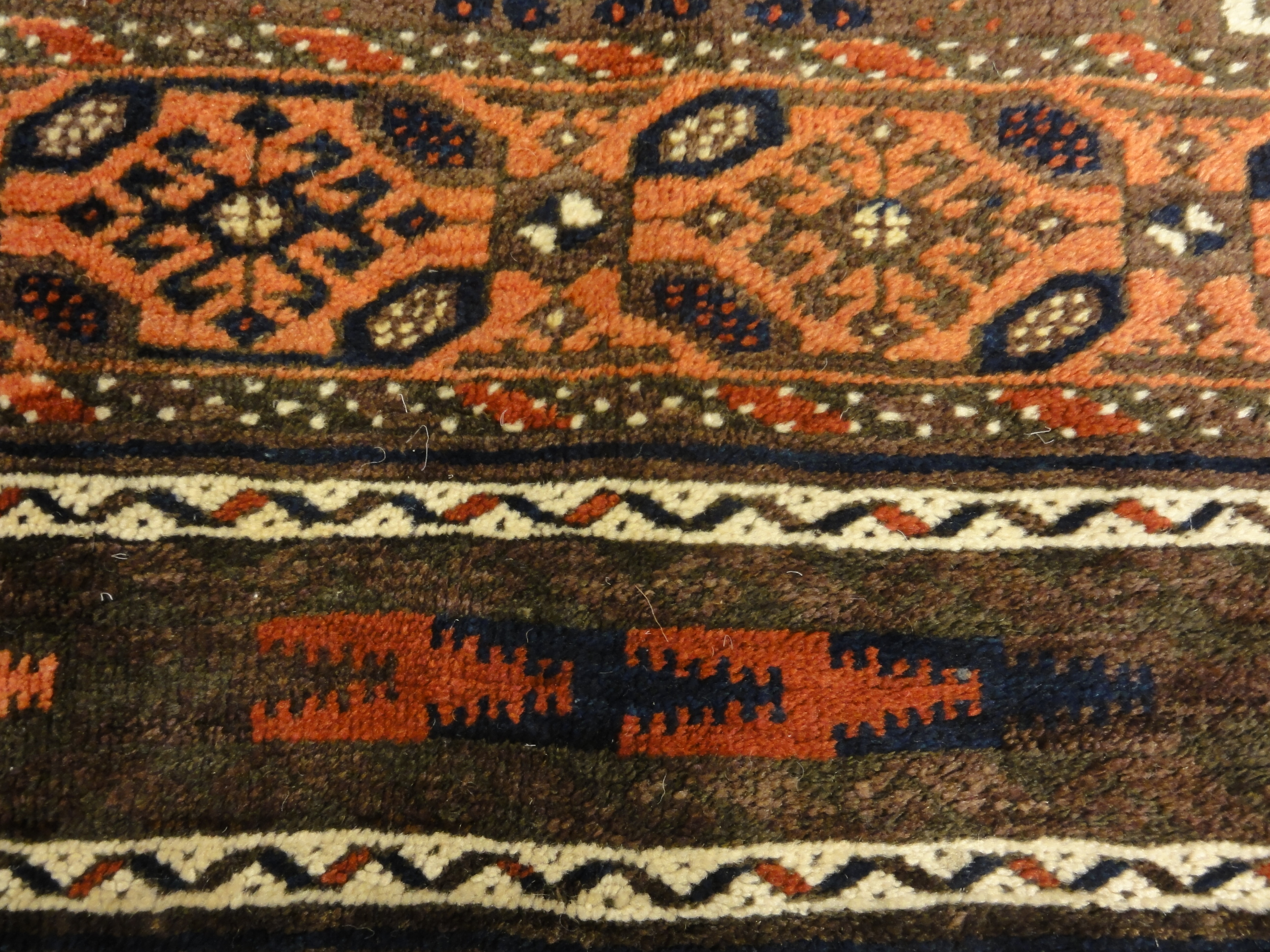 Antique Original Baluch with 3 Medallions and Unique Knotted Ends. An Afghan piece of original genuine woven carpet art sold by Santa Barbara Design Center.