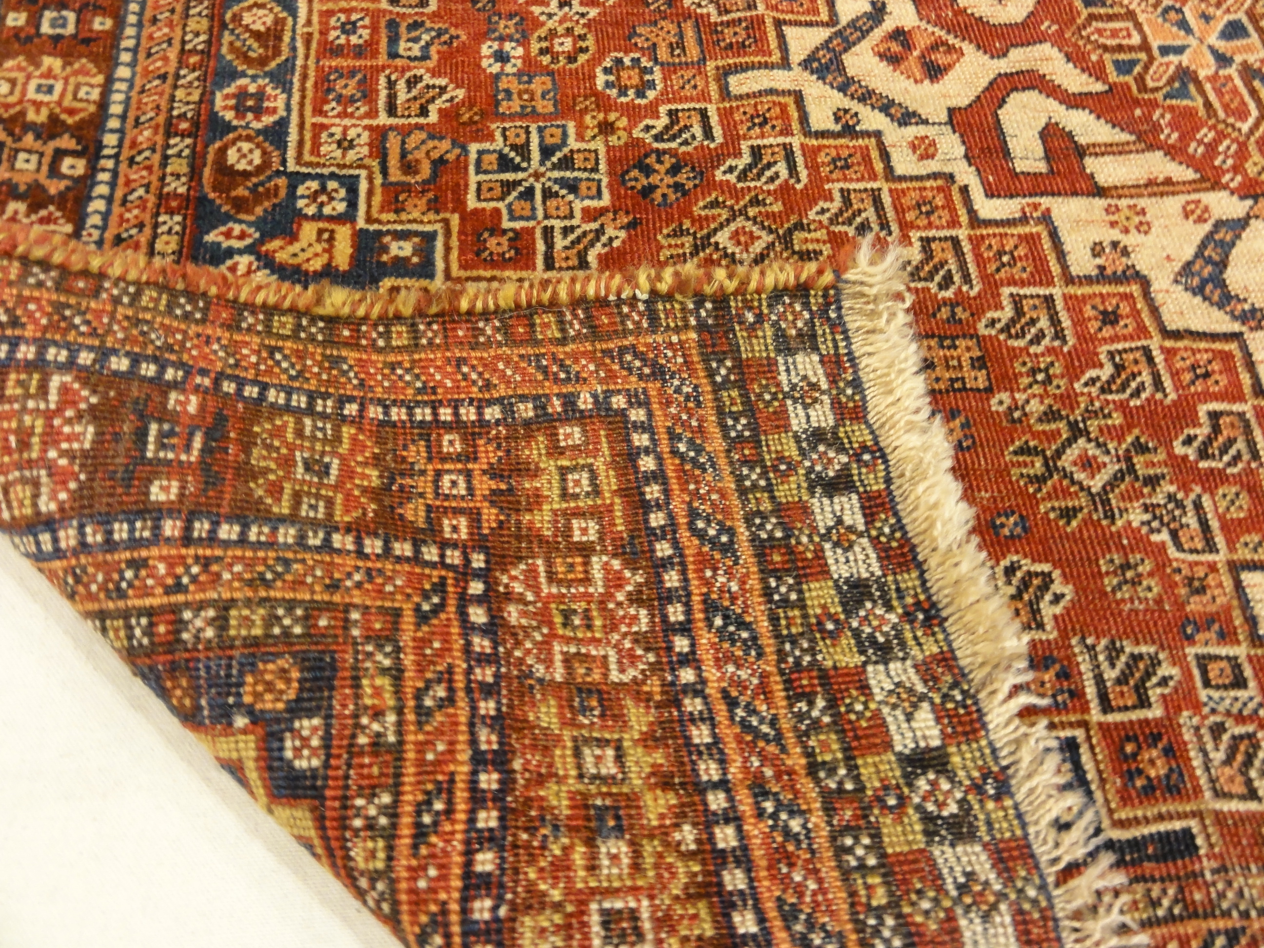 Antique Persian Qashqai Rug. A piece of genuine woven carpet art sold by the Santa Barbara Design Center, Rugs and More in Santa Barbara, California.