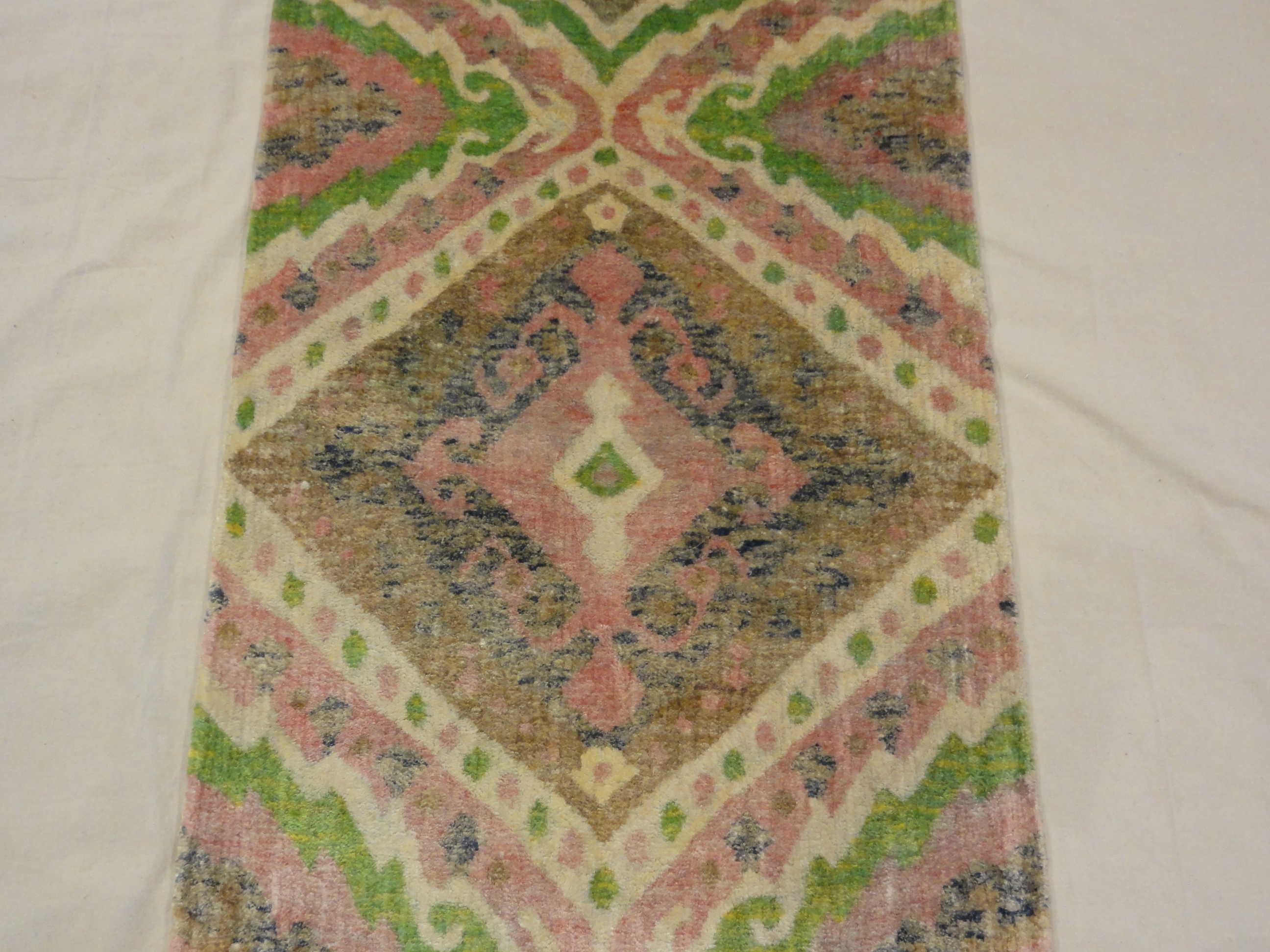 Lovely Patterned Green and Pink Runner. A piece of genuine woven authentic carpet art sold by Santa Barbara Design Center, Rugs and More.