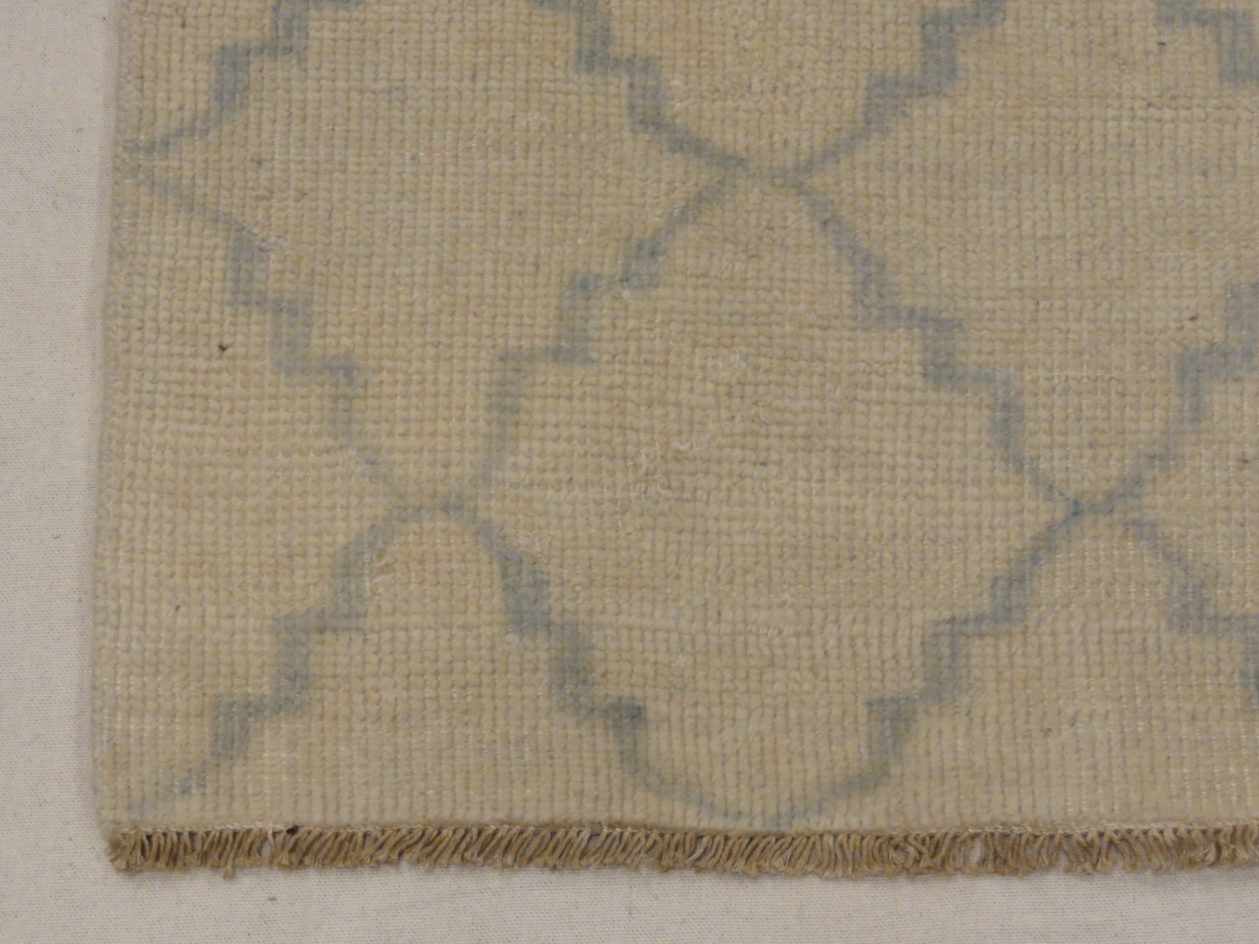 Blue and Beige Modern Trellised Rug. A piece of genuine woven carpet art sold by the Santa Barbara Design Center, Rugs and More.