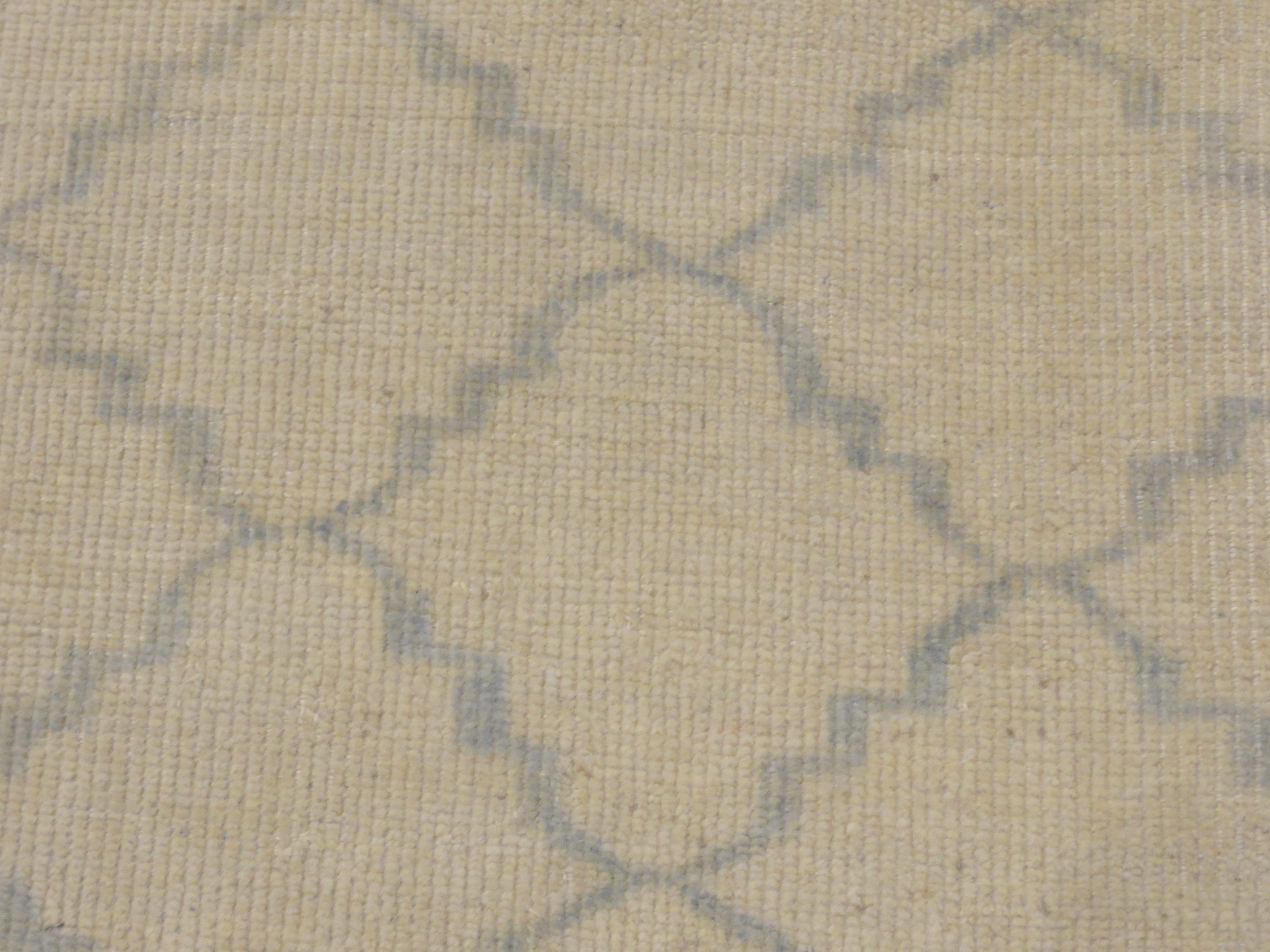 Blue and Beige Modern Trellised Rug. A piece of genuine woven carpet art sold by the Santa Barbara Design Center, Rugs and More.