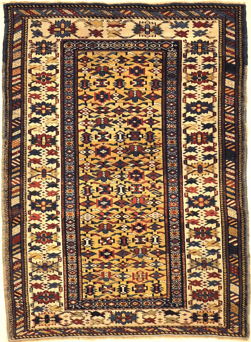 Antique Rare Gold Kuba Chichi Rug. A genuine authentic antique piece of carpet art sold by the Santa Barbara Design Center, Rugs and More.