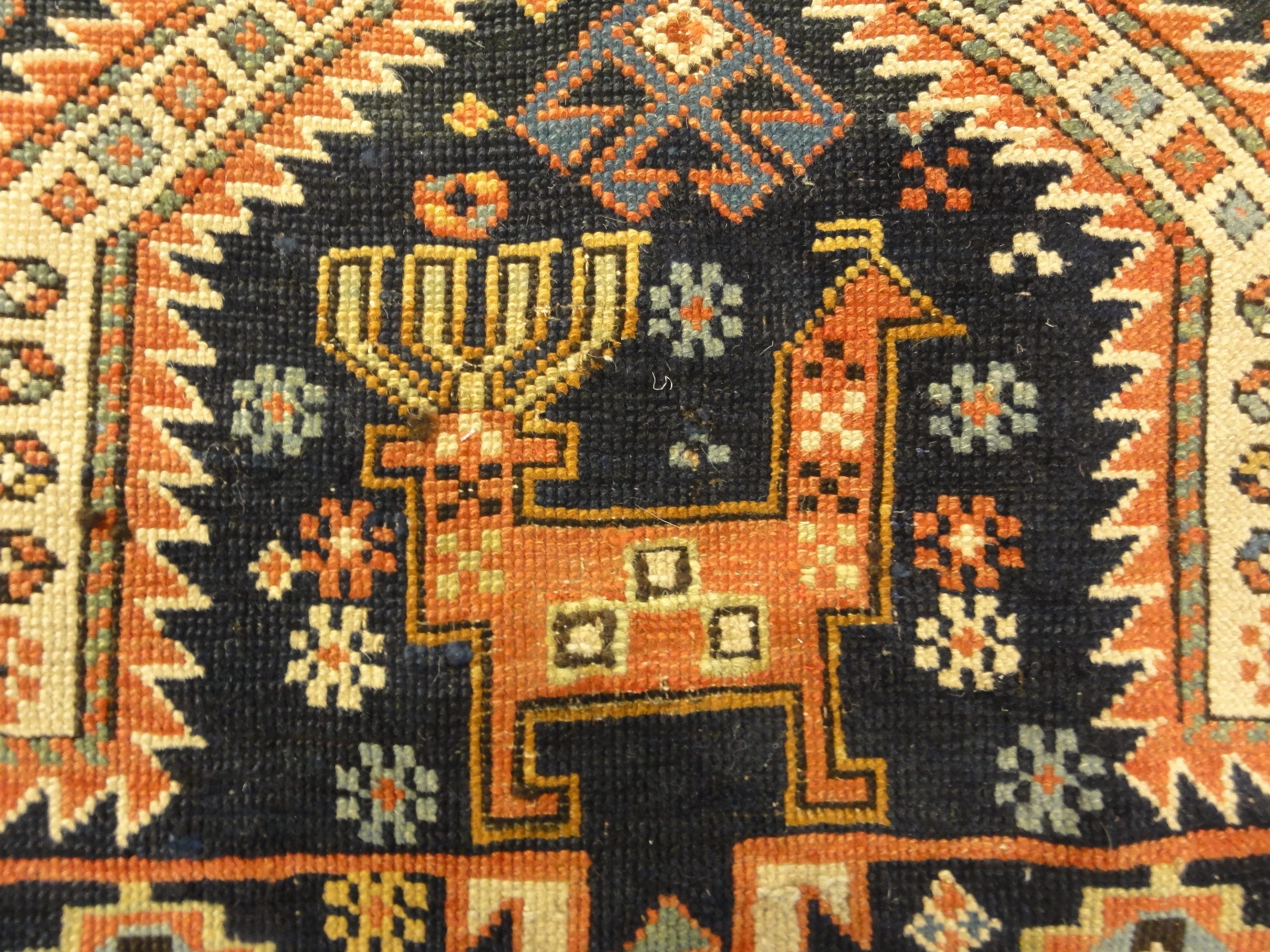 Antique Shirvan Rug Featuring Peacock and Two Men. A genuine authentic antique piece of woven carpet art sold by Santa Barbara Design Center, Rugs and More.