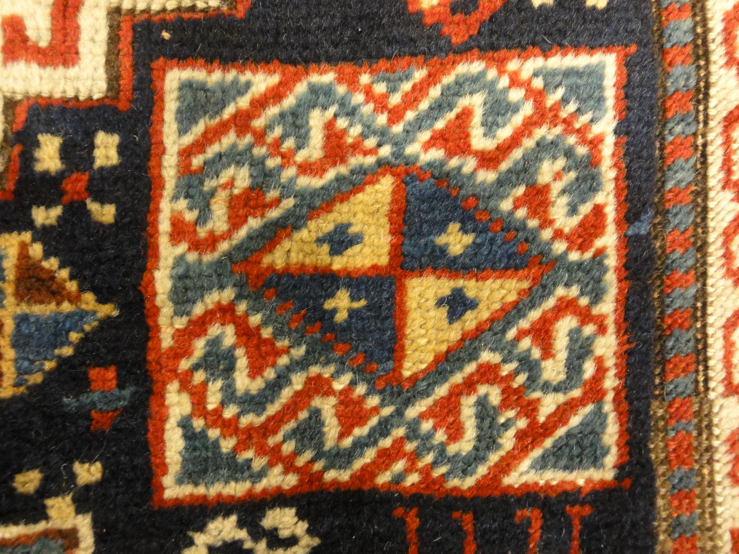 Caucasian Marriage Rug From 1880s. A piece of genuine antique woven carpet art sold by the Santa Barbara Design Center, Rugs and More.