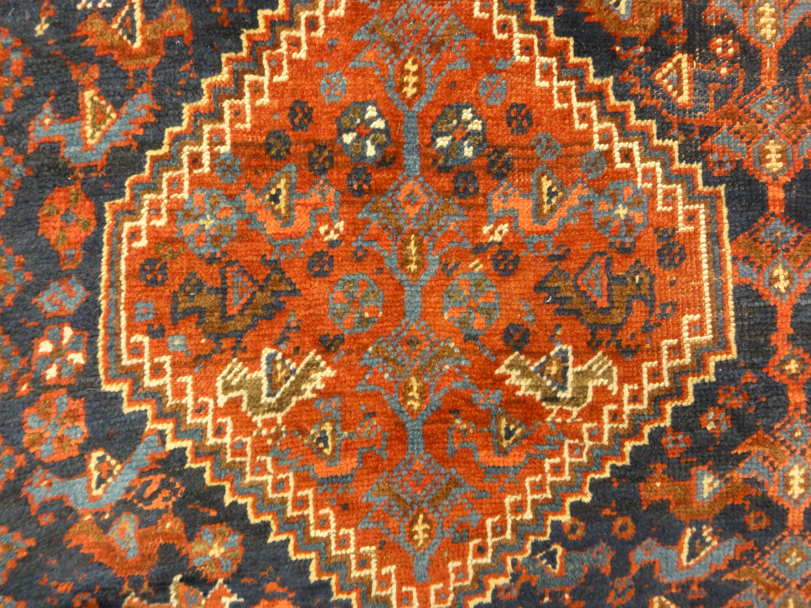 Antique Khamseh Chicken Rug. A piece of genuine authentic antique woven carpet art sold by Santa Barbara Design Center, Rugs and More.