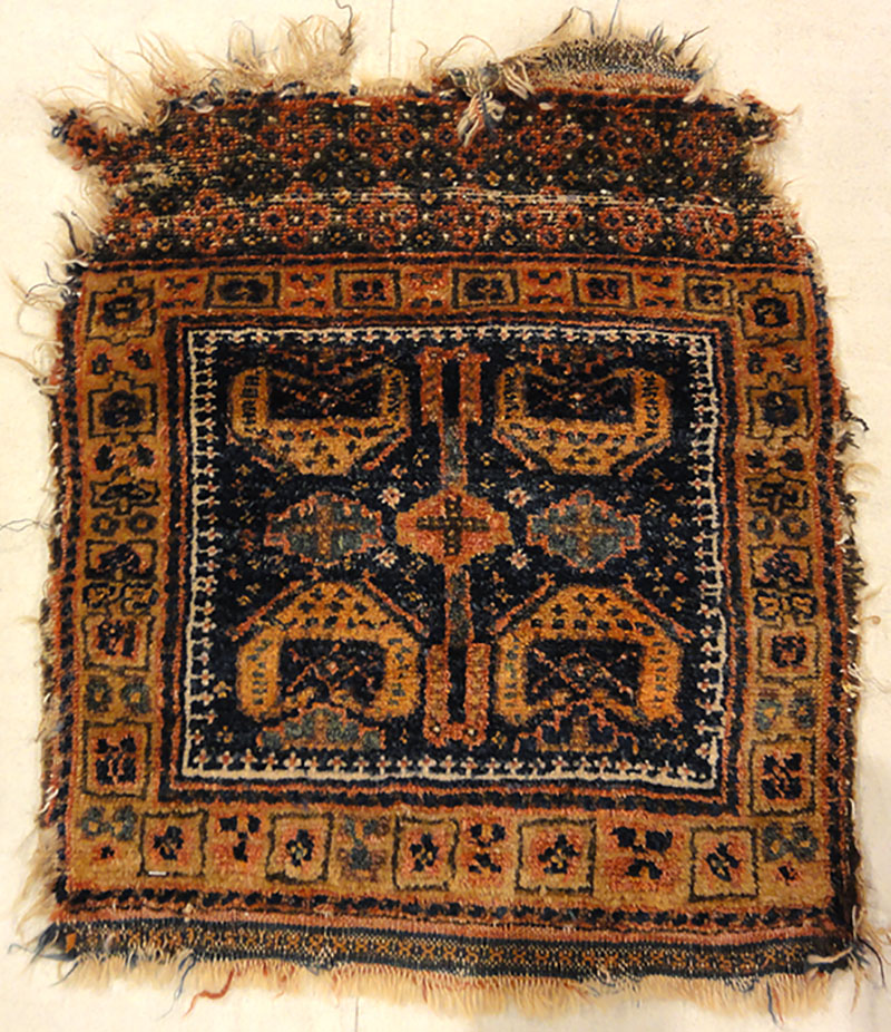 Antique Kurdish West Persian Bagface with Peacocks. A piece of genuine authentic antique woven carpet art sold by Santa Barbara Design Center Rugs and More