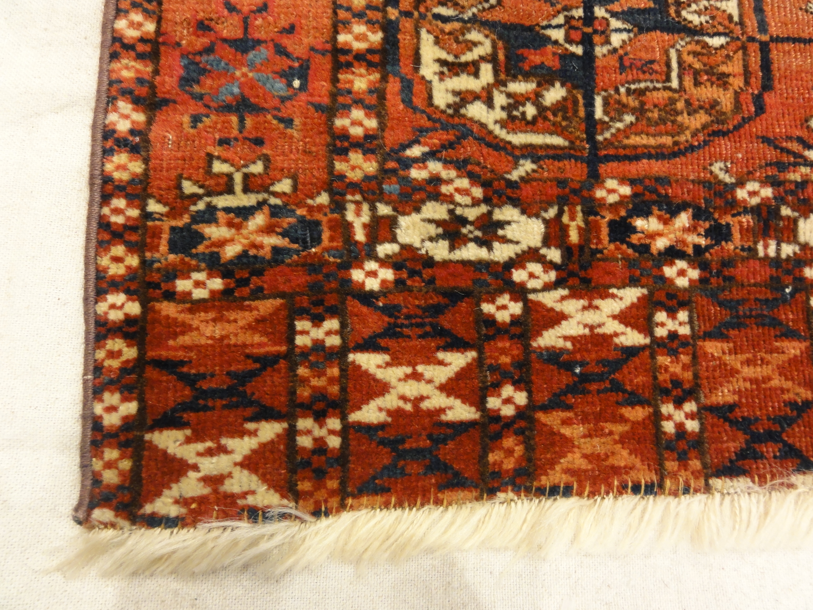Fine Antique Tekke Bukhara Rug. A piece of genuine authentic woven carpet art sold by the Santa Barbara Design Center Rugs and More.