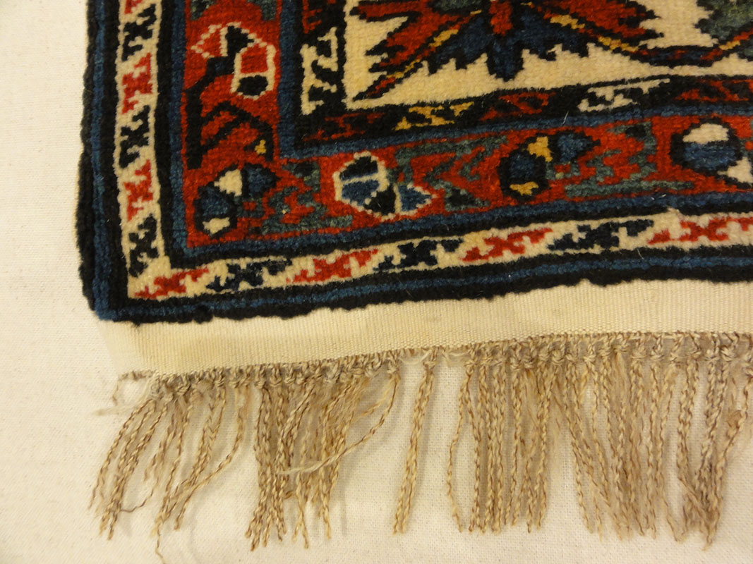 Amazing Caucasian Shirvan Baku Rug. An antique piece of woven carpet art sold by the Santa Barbara Design Center Rugs and More in Santa Barbara, California.