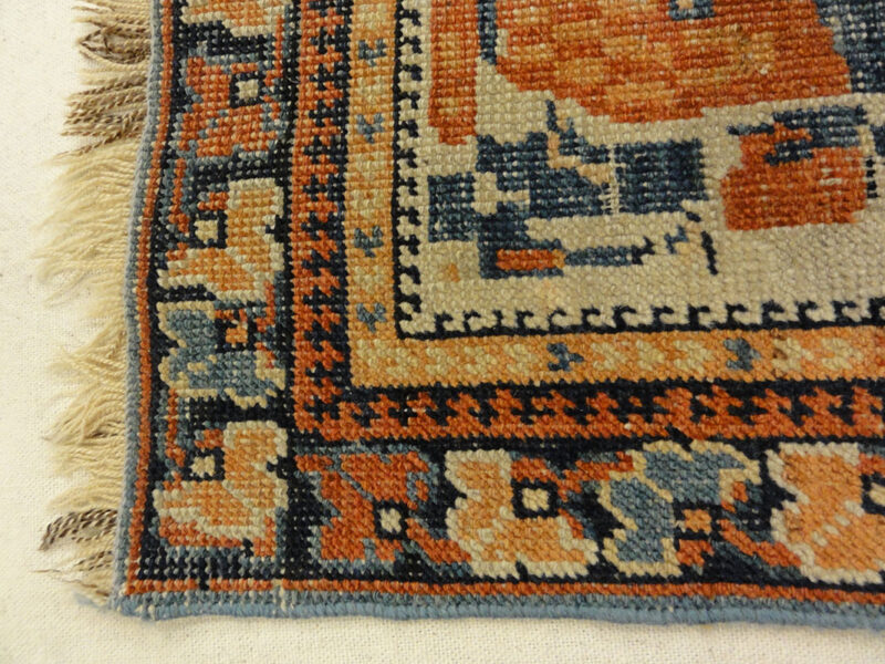 Antique Khamseh with Tribal Flowers. A piece of genuine woven carpet art sold at the Santa Barbara Design Center Rugs and More in Santa Barbara California.